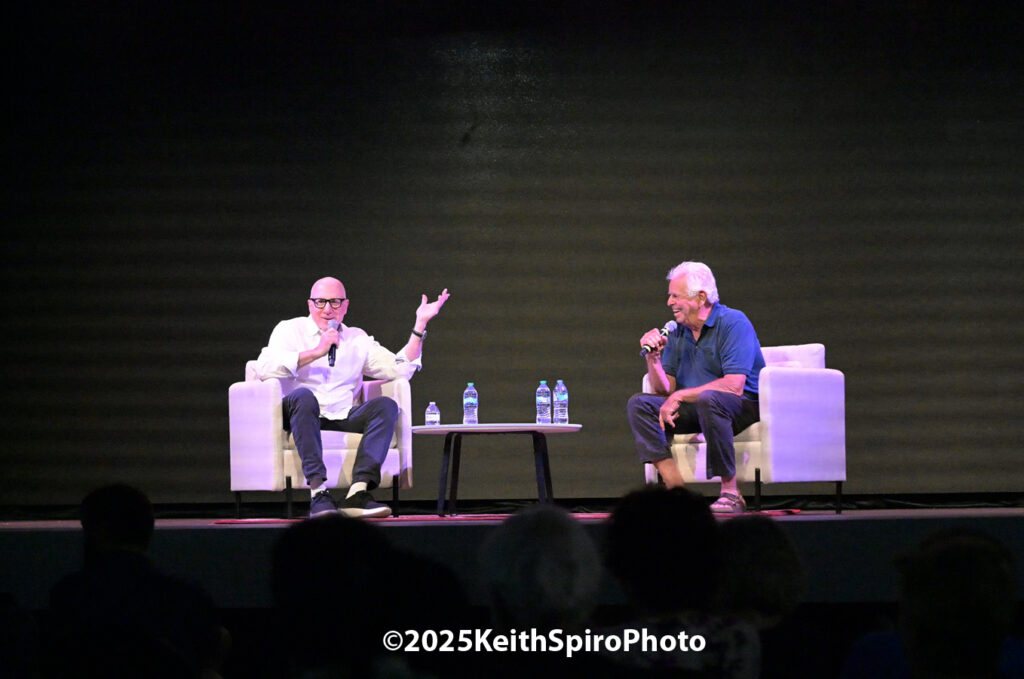 William Devane laughing in a fun conversation with friend Sam Weisman at the Rex Theatre Manchester NH in a photo by Keith Spiro